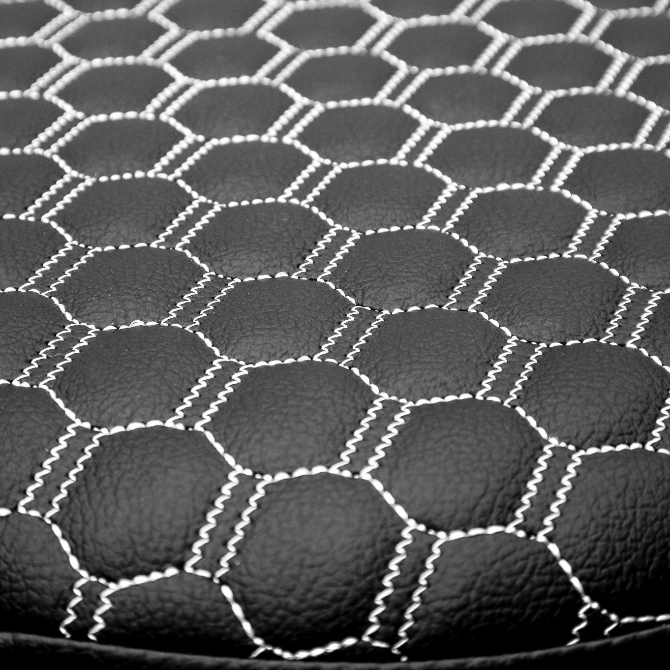 black material with white honeycomb stitching